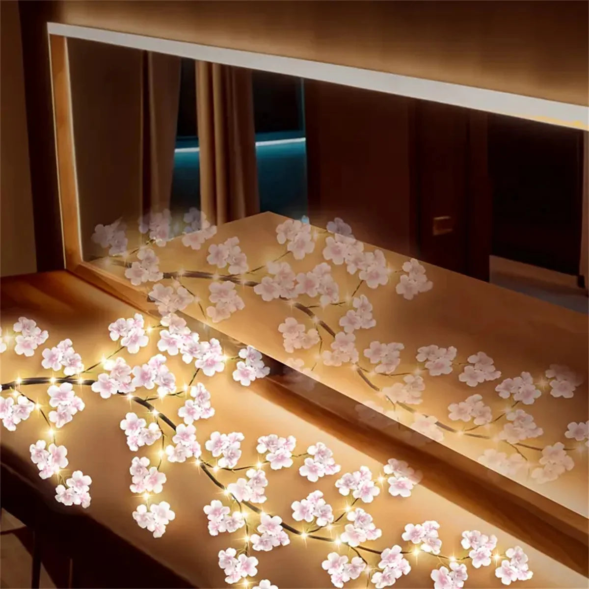 Rama de cerezo con luces LED en un dormitorio