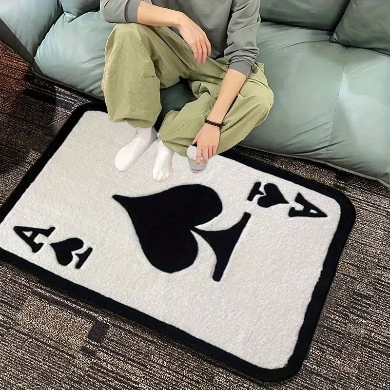 Alfombra as de picas en la entrada